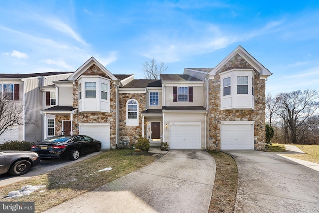 multi unit property featuring a garage