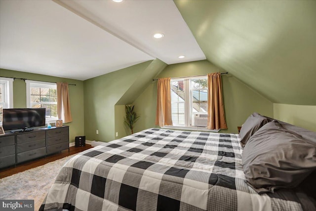 bedroom featuring lofted ceiling, cooling unit, and wood-type flooring