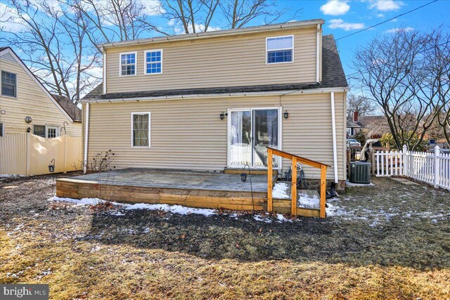 back of property featuring a wooden deck and central AC