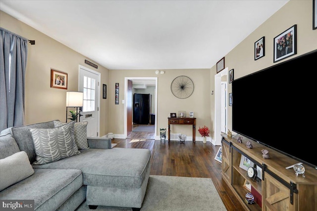 living room featuring dark hardwood / wood-style floors