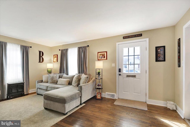 living room with dark hardwood / wood-style floors