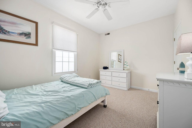 bedroom with light colored carpet and ceiling fan