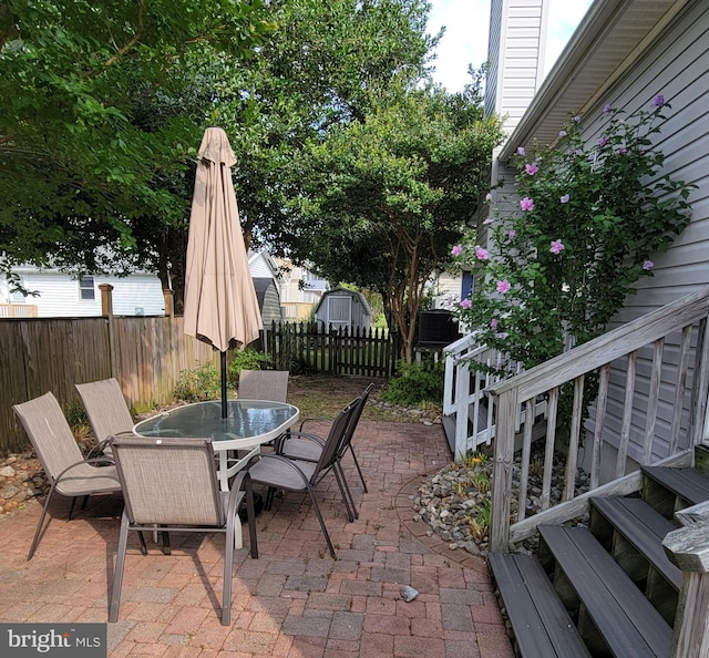 view of patio / terrace featuring a storage shed