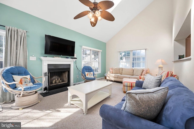 living room featuring ceiling fan, light colored carpet, and high vaulted ceiling