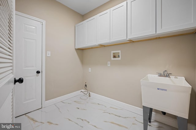 laundry area featuring cabinets, sink, and washer hookup