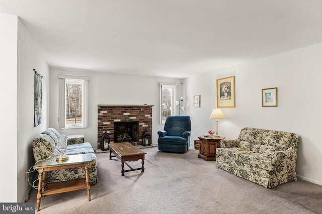 living room with a fireplace, plenty of natural light, and carpet flooring