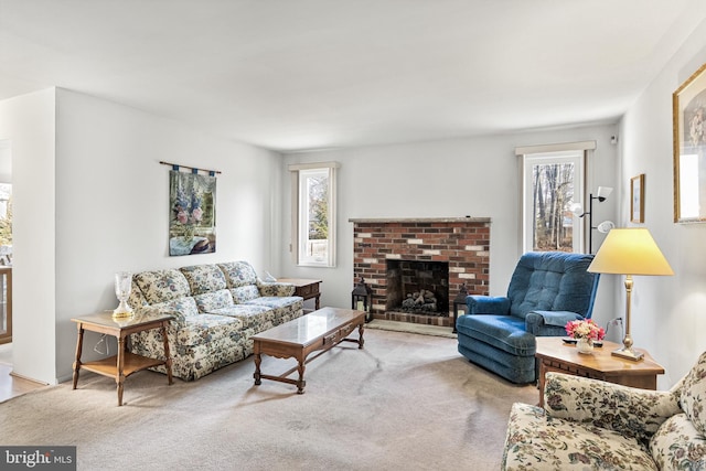 carpeted living room featuring a fireplace and plenty of natural light