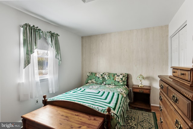 bedroom with hardwood / wood-style flooring