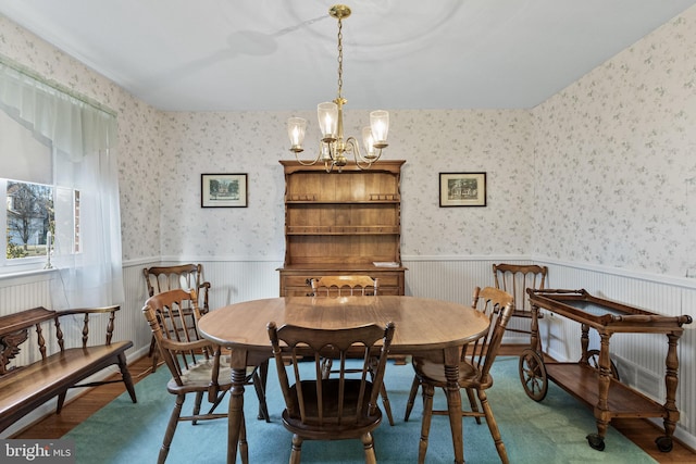 dining room with a chandelier and hardwood / wood-style floors