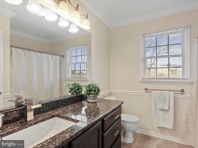 bathroom featuring toilet, vanity, tile patterned flooring, and crown molding