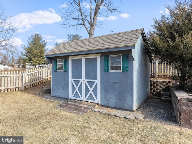 view of outbuilding with a lawn