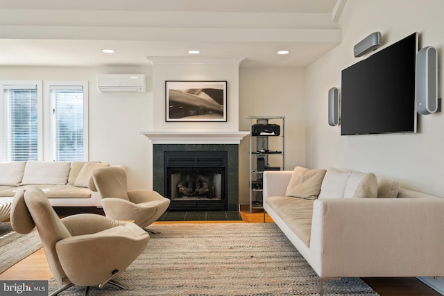 living room with a wall mounted air conditioner and wood-type flooring