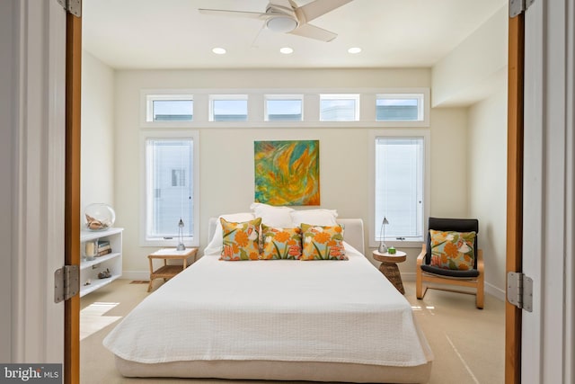 bedroom with light colored carpet and ceiling fan