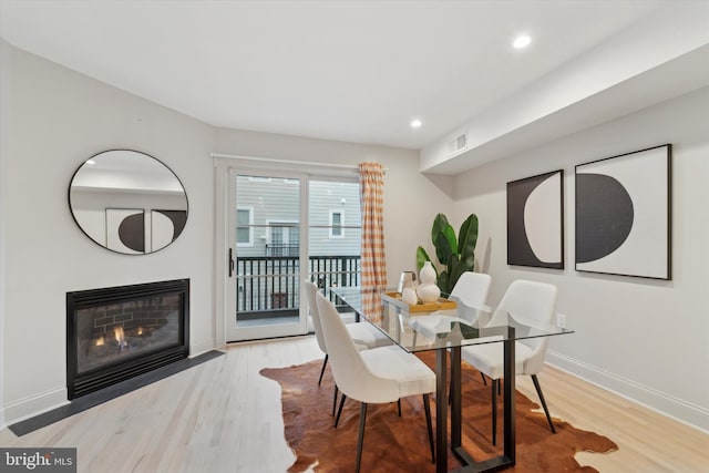 dining area featuring light wood-type flooring