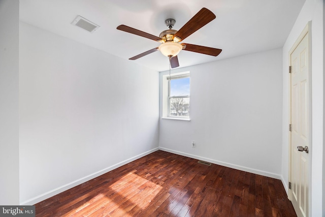 unfurnished room featuring dark wood-type flooring and ceiling fan