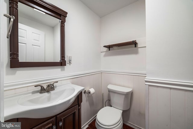 bathroom with vanity and toilet