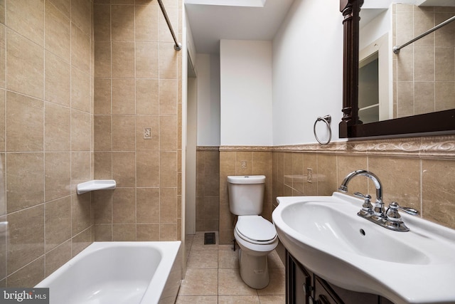 full bathroom featuring shower / tub combination, tile walls, tile patterned flooring, vanity, and toilet