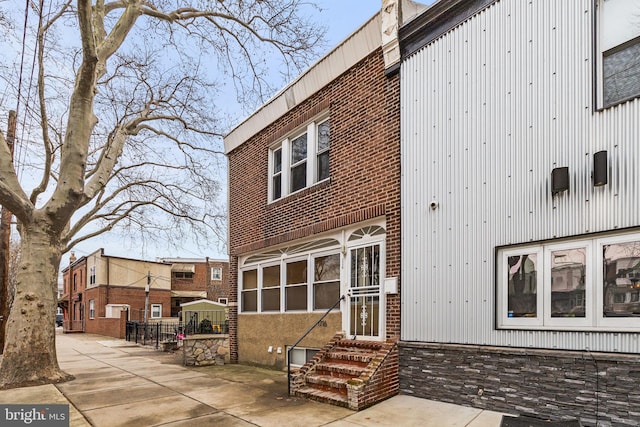 back of property with a patio