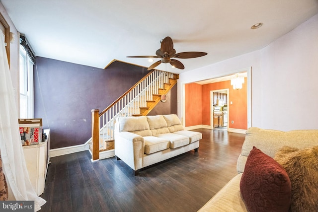 living room featuring dark hardwood / wood-style floors and ceiling fan