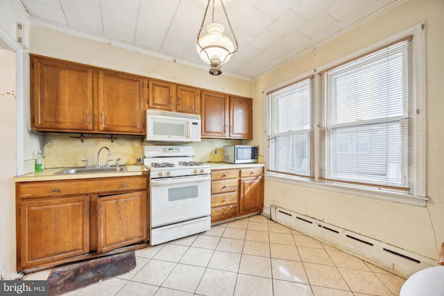 kitchen with sink, a baseboard radiator, ornamental molding, pendant lighting, and white appliances