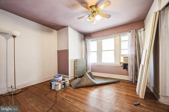 miscellaneous room featuring dark hardwood / wood-style floors, radiator heating unit, and ceiling fan