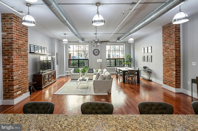 living room with hardwood / wood-style flooring and ceiling fan