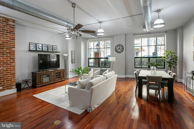 living room featuring hardwood / wood-style flooring, a wealth of natural light, and ceiling fan