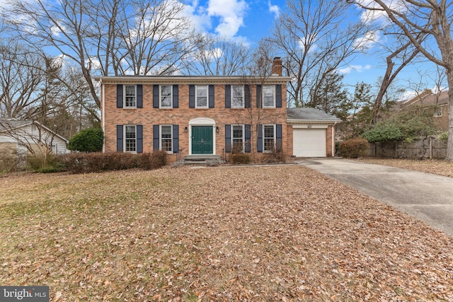 colonial-style house featuring a garage