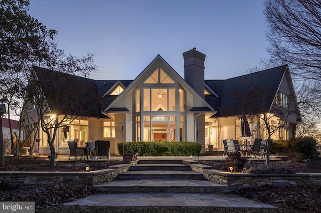 exterior space featuring a patio area and a chimney