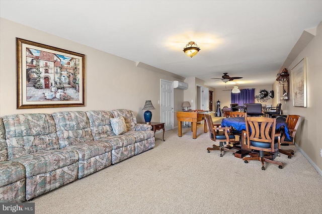 living room with baseboards, a ceiling fan, carpet flooring, and an AC wall unit
