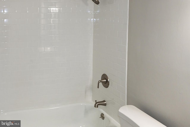 bathroom with toilet and tub / shower combination