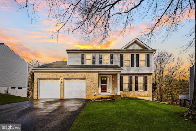 view of front of property with a lawn