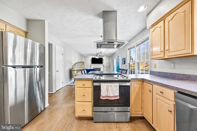 kitchen featuring light brown cabinets, light wood-type flooring, stainless steel appliances, and island exhaust hood