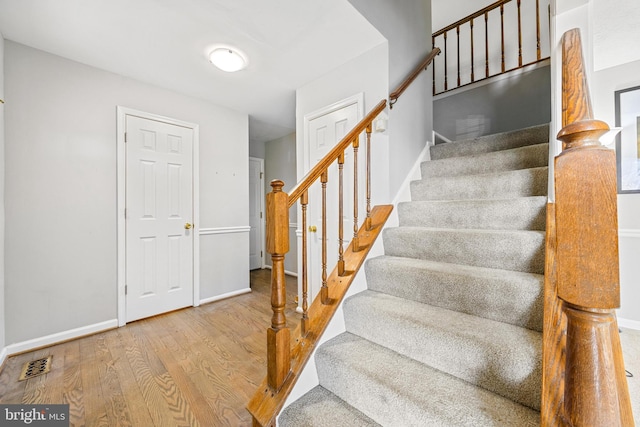 stairway with wood-type flooring