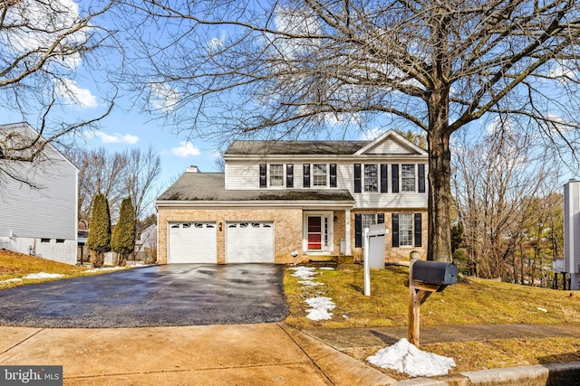 front of property featuring a garage and a front yard