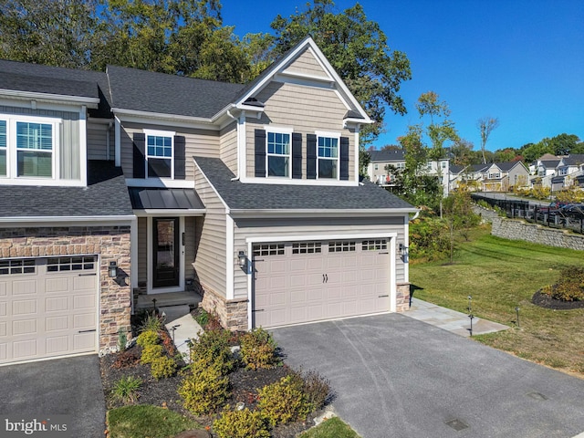 view of front facade featuring a garage and a front yard