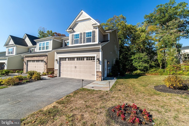 view of front facade with a garage and a front yard