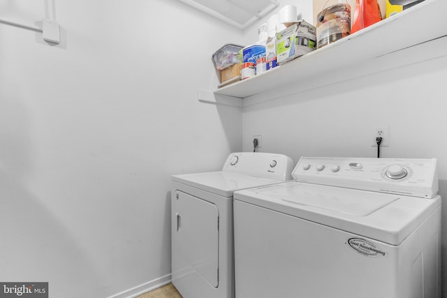 laundry room featuring washing machine and dryer