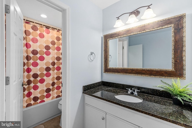 full bathroom featuring vanity, shower / bathtub combination with curtain, and toilet