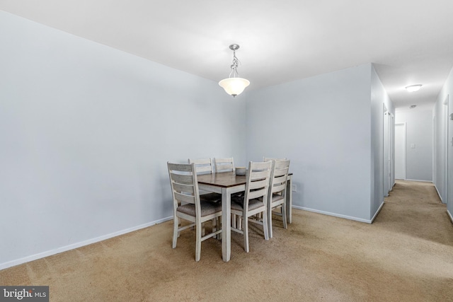 view of carpeted dining area