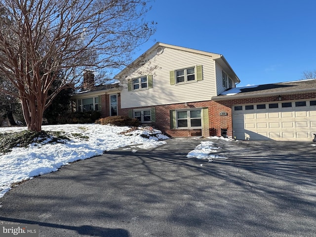 split level home featuring a garage