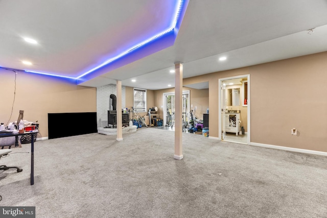 below grade area featuring carpet floors, baseboards, and recessed lighting