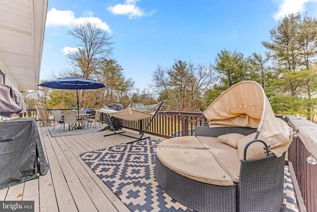 wooden terrace featuring outdoor dining space