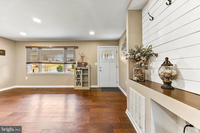 foyer with recessed lighting, visible vents, baseboards, and wood finished floors