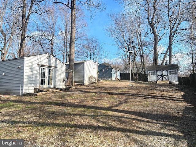 view of yard featuring a storage unit