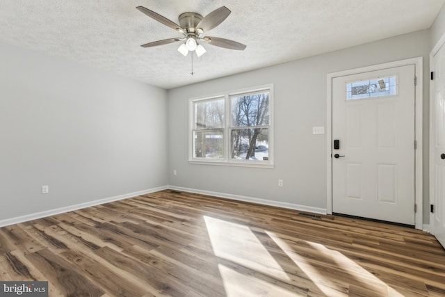 entryway with hardwood / wood-style floors, a textured ceiling, and ceiling fan