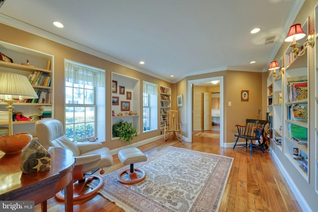 sitting room featuring recessed lighting, visible vents, baseboards, built in features, and light wood-style floors