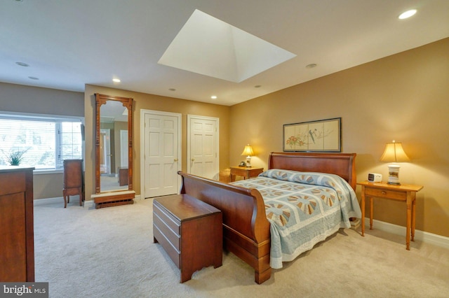 bedroom with recessed lighting, baseboards, and light colored carpet