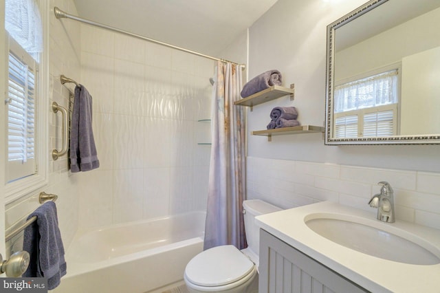 full bath featuring toilet, a wainscoted wall, tile walls, vanity, and shower / tub combo with curtain