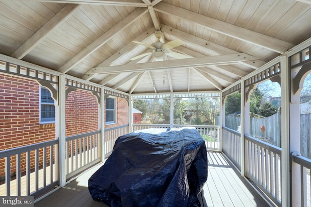 wooden deck with ceiling fan and a gazebo